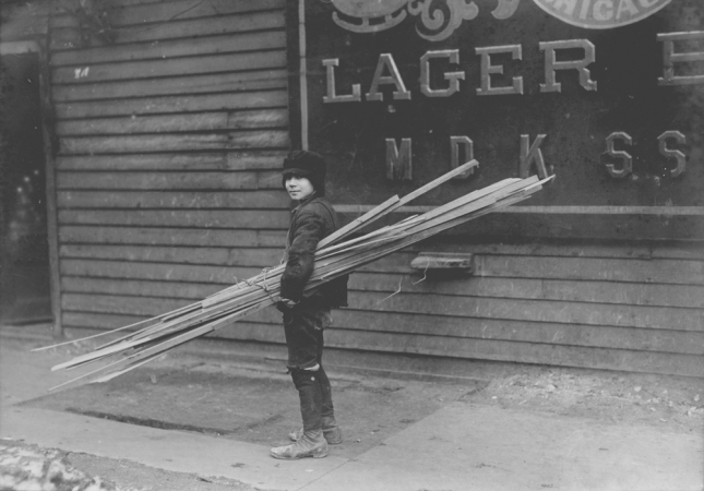 Lewis Hine<br /> <i>Boy with Lumber, </i>1910<br /> Silver gelatin print<br /> 4 5/8 x 6 9/16 inches (unique)