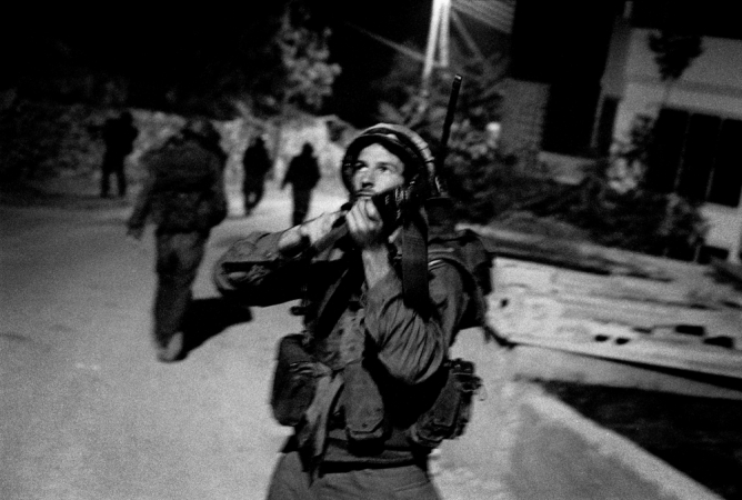 Paolo Pellegrin<br /> <em>Israeli reservists on patrol, hunting suicide bombers, West Bank, Palestine</em>, 2002<br /> Pigment ink print<br /> 20 x 24” &nbsp; &nbsp;Edition of 10 plus 2 APs<br /> 30 x 40” &nbsp; &nbsp;Edition of 5 plus 2 APs<br /> 48 x 70” &nbsp; &nbsp;Edition of 3 plus 2 APs&nbsp;<br />