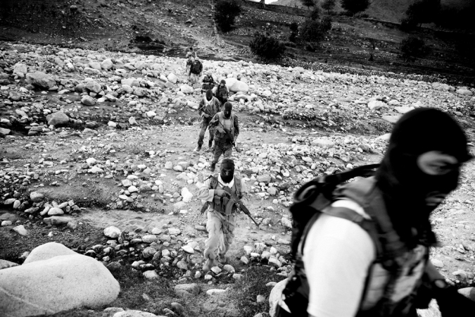 Paolo Pellegrin<br /> <em>DEA and Afghan interdiction troops stage an assault on a village, Nangahar province, South East of Jalalabad, Afghanistan. May 2006</em><br /> Pigment ink print<br />20 x 24” &nbsp; &nbsp;Edition of 10 plus 2 APs<br /> 30 x 40” &nbsp; &nbsp;Edition of 5 plus 2 APs<br /> 48 x 70” &nbsp; &nbsp;Edition of 3 plus 2 APs