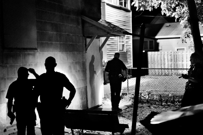 Paolo Pellegrin<br /> <em>Several police officers search a house for an armed suspect in Northeast Rochester. Rochester, NY. USA 2012</em><br /> Pigment ink print<br />20 x 24” &nbsp; &nbsp;Edition of 10 plus 2 APs<br /> 30 x 40” &nbsp; &nbsp;Edition of 5 plus 2 APs<br /> 48 x 70” &nbsp; &nbsp;Edition of 3 plus 2 APs