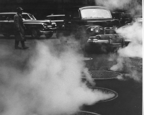 Benn Mitchell, NYC Cars over steamed street, 1950