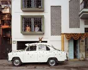 Laura McPhee<br /> <em><span style="font-size:12px;"><span style="font-family: arial, sans-serif;">Ambassador Car Decorated for a Wedding by a Net Strung with Fresh Flowers, South Kolkata, 1998</span></span></em><br /> Archival Pigment Ink Prints<br /> 30 x 40" &nbsp; &nbsp;Edition of 5<br /> 40 x 50" &nbsp; &nbsp;Edition of 5<br /> 50 x 60" &nbsp; &nbsp;Edition of 5<br /> 60 x 75" &nbsp; &nbsp;Edition of 5