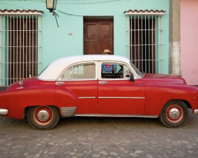 Jeffrey Milstein<br /> <em>Car and Superman, Trinidad, Cuba, </em>2004<br /> Archival pigment prints<br /> 16 x 24" &nbsp; &nbsp;Edition of 15<br /> 22 x 33" &nbsp; &nbsp;Edition of 5