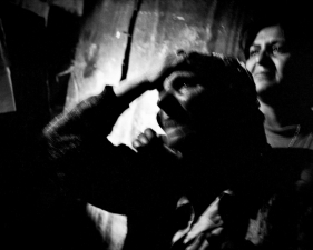 Paolo Pellegrin<br /> <em>A Roma (gypsy) woman whose house has been set on fire by Albanians, Town of Pristina, KOSOVO, 2000</em><br/> Pigment ink print<br />20 x 24” &nbsp; &nbsp;Edition of 10 plus 2 APs<br /> 30 x 40” &nbsp; &nbsp;Edition of 5 plus 2 APs<br /> 48 x 70” &nbsp; &nbsp;Edition of 3 plus 2 APs