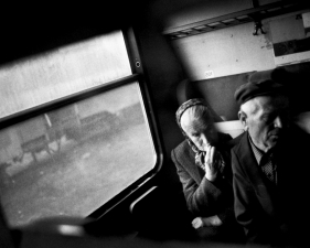 Paolo Pellegrin<br /> <em>Elderly Serbian couple on a "Serb train", KOSOVO and ALBANIA, 2000</em><br /> Pigment ink print<br />20 x 24” &nbsp; &nbsp;Edition of 10 plus 2 APs<br /> 30 x 40” &nbsp; &nbsp;Edition of 5 plus 2 APs<br /> 48 x 70” &nbsp; &nbsp;Edition of 3 plus 2 APs