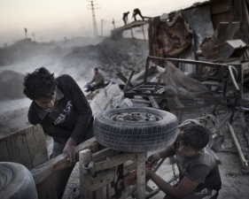 Paolo Pellegrin<br /> <em>Gazans fix a donkey cart for collecting mountains of rubble left in 2008-09 by Operation Cast Lead, Gaza, Palestine 2011</em><br /> Pigment ink print<br />20 x 24” &nbsp; &nbsp;Edition of 10 plus 2 APs<br /> 30 x 40” &nbsp; &nbsp;Edition of 5 plus 2 APs<br /> 48 x 70” &nbsp; &nbsp;Edition of 3 plus 2 APs