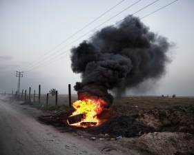 Paolo Pellegrin<br /> <em>Rubber tires are set on fire to make a powder which will be mixed to cement. East Jabalia. Gaza 2011</em><br /> Pigment ink print<br />20 x 24” &nbsp; &nbsp;Edition of 10 plus 2 APs<br /> 30 x 40” &nbsp; &nbsp;Edition of 5 plus 2 APs<br /> 48 x 70” &nbsp; &nbsp;Edition of 3 plus 2 APs