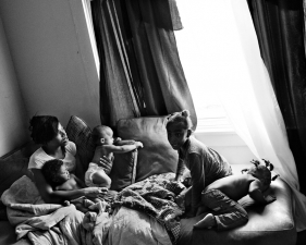 Paolo Pellegrin<br /> <em>A young mother with her four children in the Crescent area of Rochester. Rochester, NY. USA 2012</em><br /> Pigment ink print<br />20 x 24” &nbsp; &nbsp;Edition of 10 plus 2 APs<br /> 30 x 40” &nbsp; &nbsp;Edition of 5 plus 2 APs<br /> 48 x 70” &nbsp; &nbsp;Edition of 3 plus 2 APs