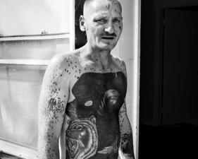Paolo Pellegrin<br /> <em>A tattooed man in Northeast Rochester. Rochester, NY. USA 2012</em><br /> Pigment ink print<br /> 24 x 20” &nbsp; &nbsp;Edition of 10 plus 2 APs<br /> 40 x 30” &nbsp; &nbsp;Edition of 5 plus 2 APs<br /> 70 x 48” &nbsp; &nbsp;Edition of 3 plus 2 APs