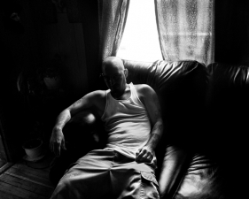 Paolo Pellegrin<br /> <em>Snoe, a former Latin King gang member who is now a successful graffiti and tattoo artist, at his home in Northeast Rochester. Rochester, NY. USA 2012</em><br />20 x 24” &nbsp; &nbsp;Edition of 10 plus 2 APs<br /> 30 x 40” &nbsp; &nbsp;Edition of 5 plus 2 APs<br /> 48 x 70” &nbsp; &nbsp;Edition of 3 plus 2 APs