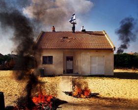 Paolo Pellegrin<br /> <em>Gaza Strip: Settlers in Gadid try to resist evacuation by Israeli forces by staying on rooftops, </em>2005<br /> Pigment ink print<br /> 20 x 24” &nbsp; &nbsp;Edition of 10 plus 2 APs<br /> 30 x 40” &nbsp; &nbsp;Edition of 5 plus 2 APs<br /> 48 x 70” &nbsp; &nbsp;Edition of 3 plus 2 APs&nbsp;<br />
