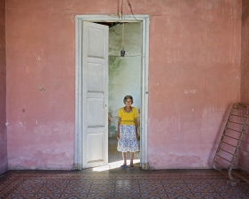 Jeffrey Milstein<br /> <em>Woman in Door, Trinidad, Cuba, </em>2004<br /> Archival pigment prints<br /> 16 x 24" &nbsp; &nbsp;Edition of 15<br /> 22 x 33" &nbsp; &nbsp;Edition of 5